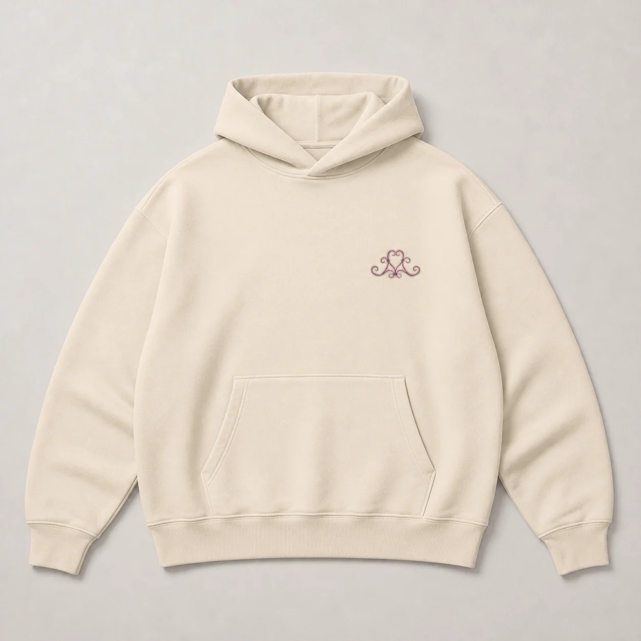 Front of the cream oversized Clammy hoodie with a small chest mark